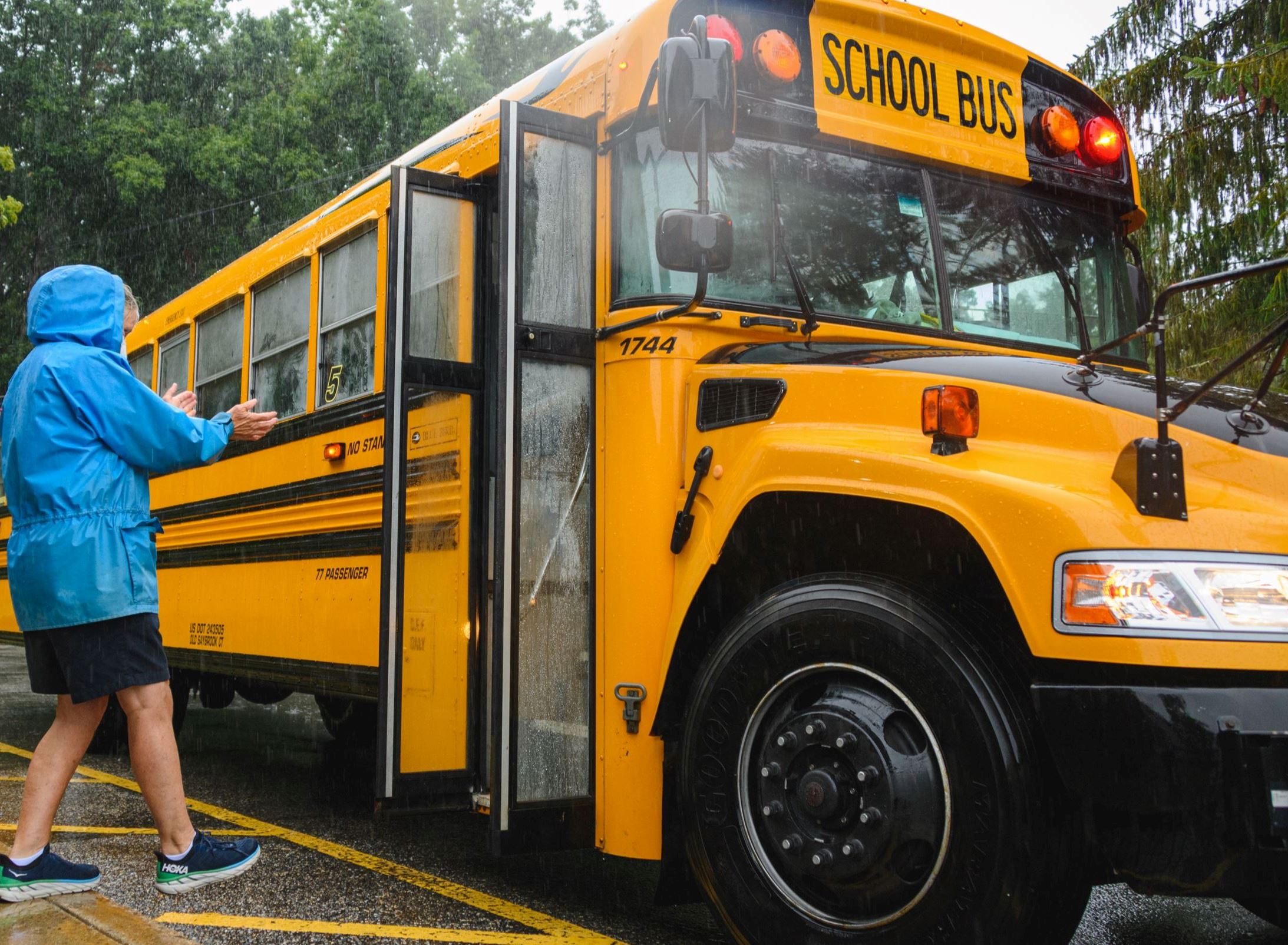 Adult meeting School Bus