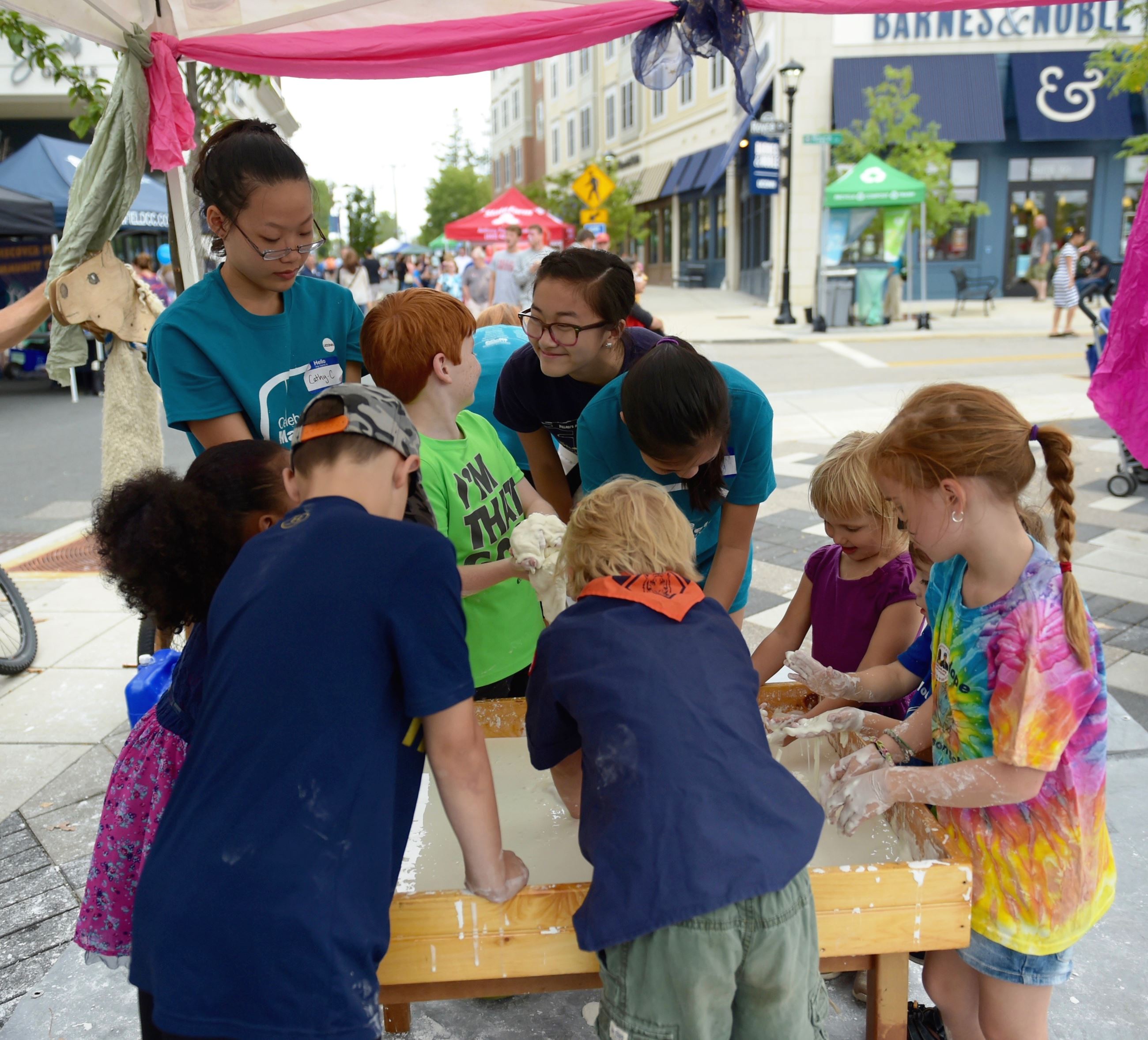 Children play at the Celebrate Mansfield Festival in Downtown Storrs